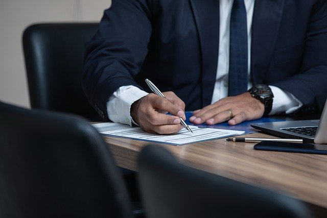 picture of man doing paperwork