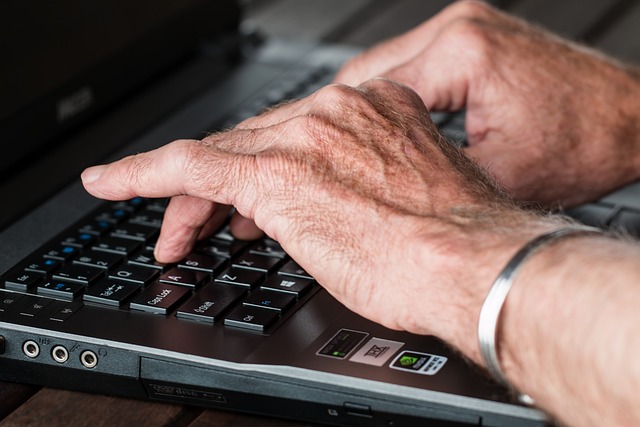 picture of person typing on laptop