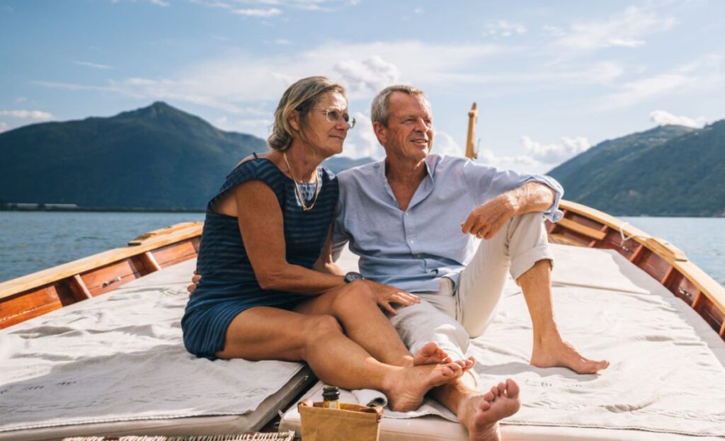 picture of couple hanging out on the water, looking peaceful