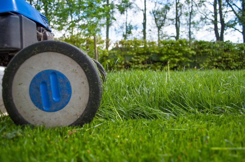 picture of lawn mower cutting grass