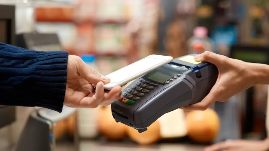 picture of girl paying with smart phone